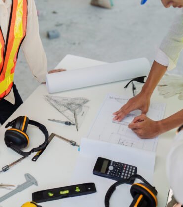 businesswoman hands using a calculator to check company finances and earnings and budget.